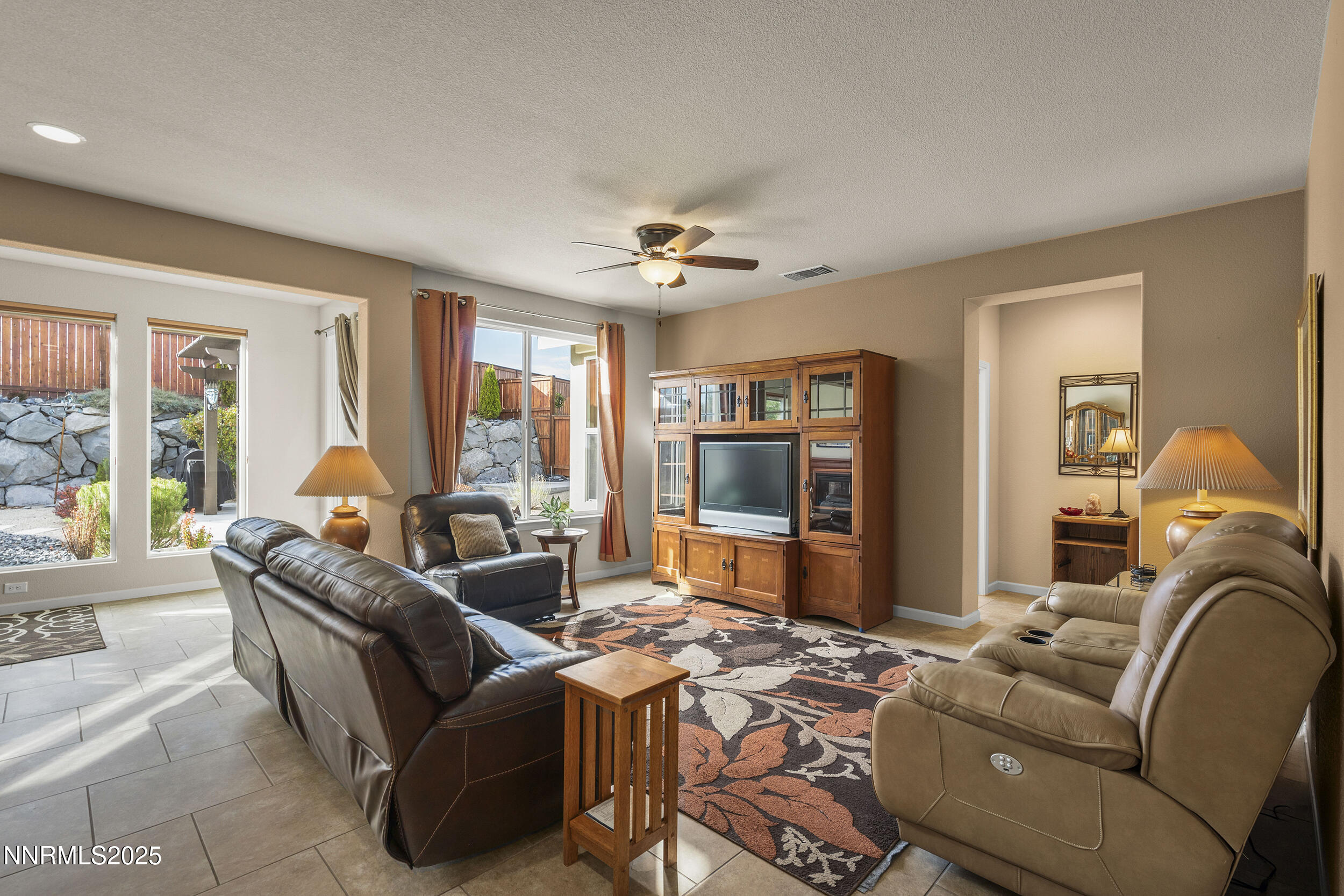 9165 Kenton Trail Reno, NV 89523 - Photo 14 of 22 a living room with furniture ceiling fan and a window