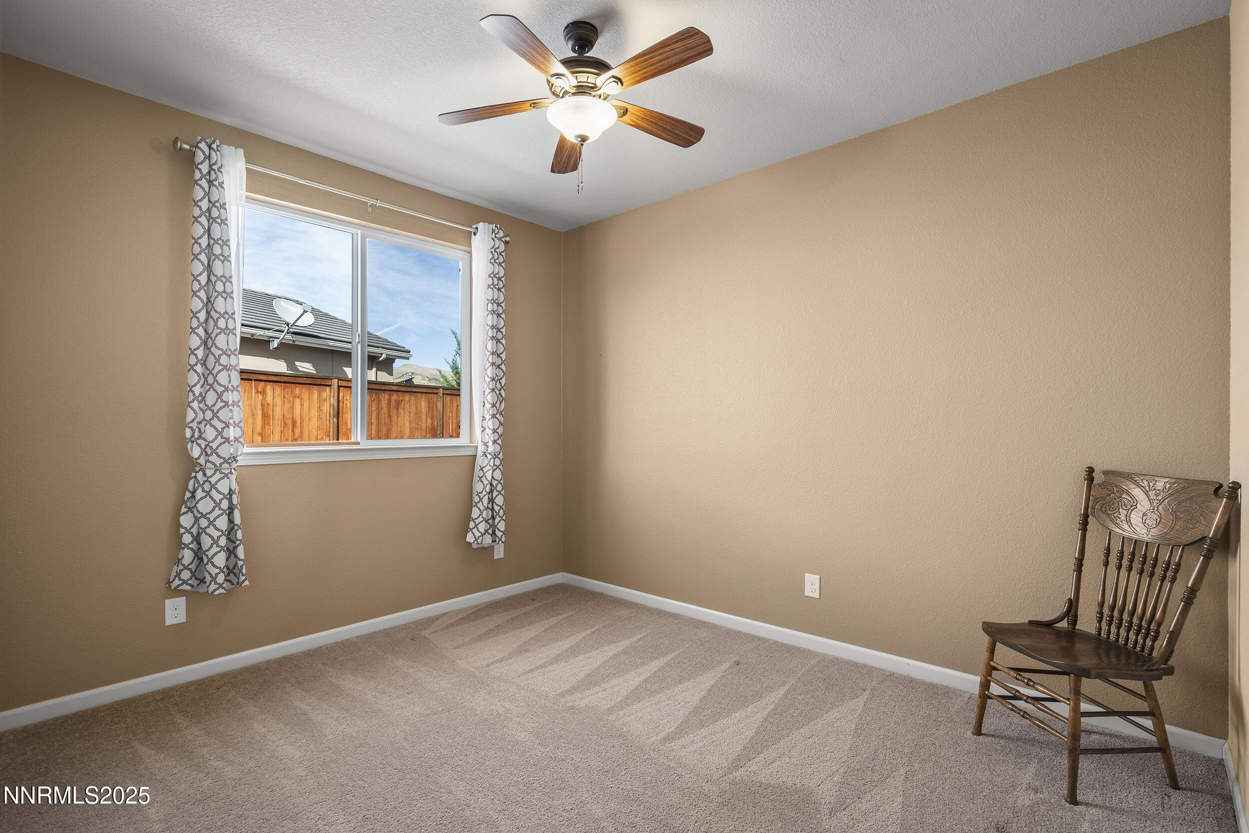 9165 Kenton Trail Reno, NV 89523 - Photo 22 of 22 a view of room with window and ceiling fan