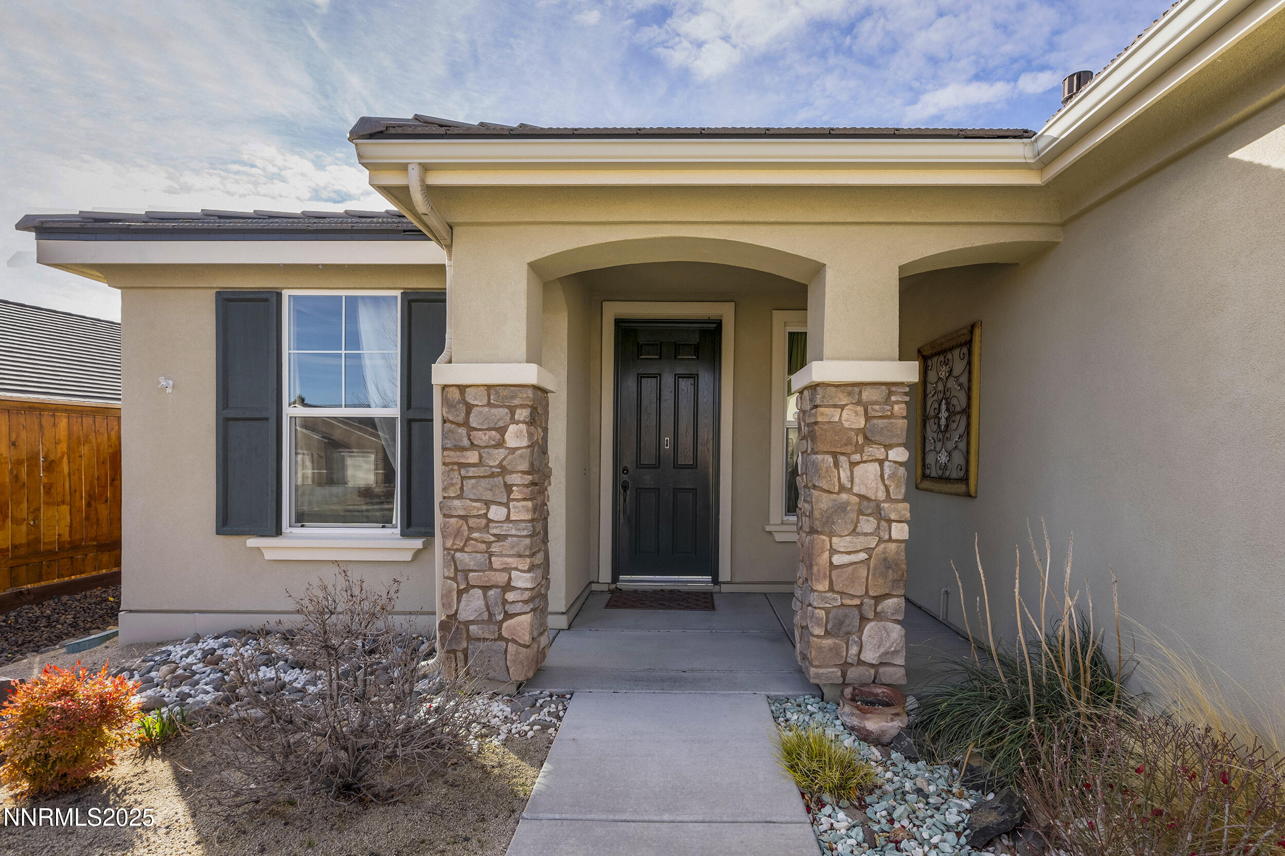 9165 Kenton Trail Reno, NV 89523 - Photo 3 of 22 a front view of a house with a blue gate