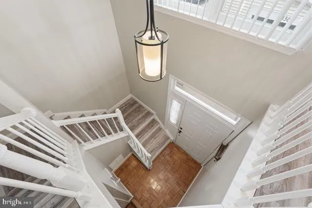 a view of an entryway with wooden floor