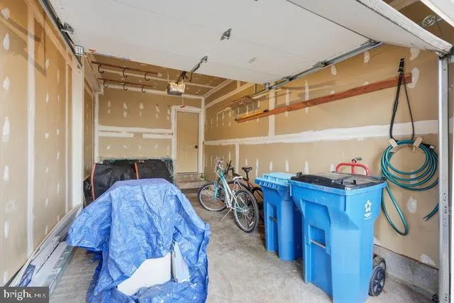 a living room with lots of furniture and lots of wooden furniture