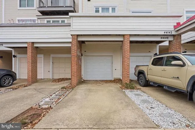 a view of a car park in front of house