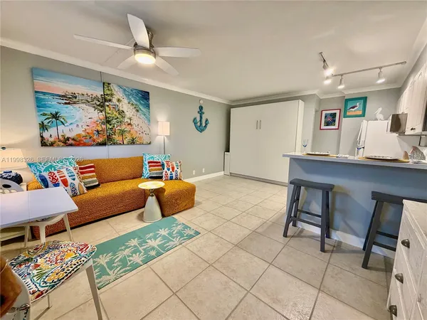 a bedroom with furniture and a rug