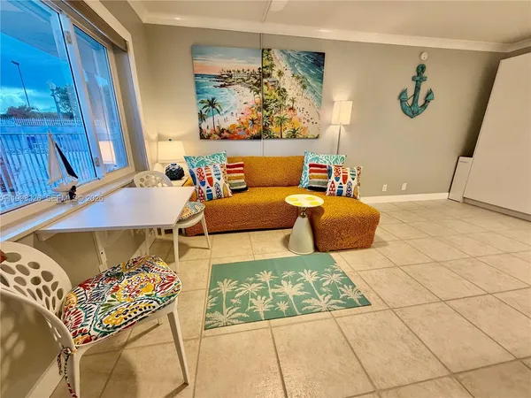 a living room with furniture and a rug