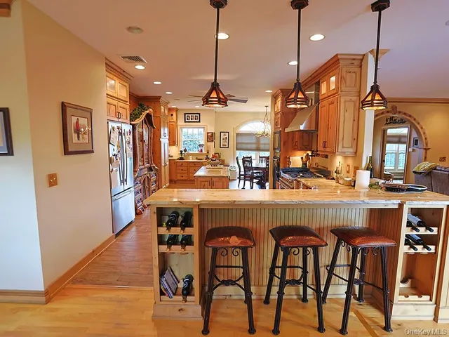 a dining table with chairs and wooden floor