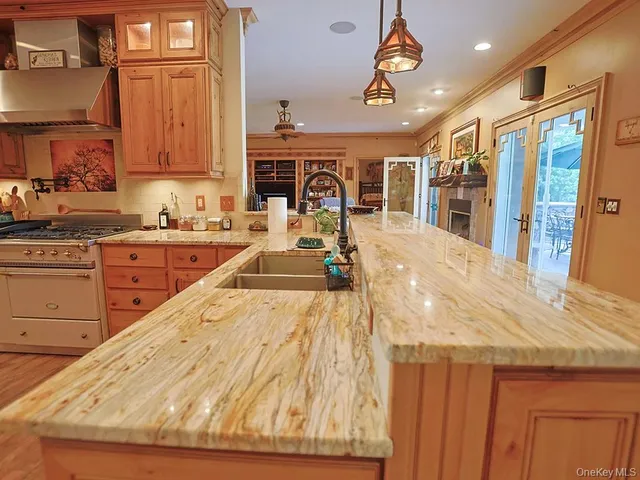 a very nice looking kitchen with a large window