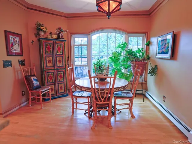 a dining room with furniture and window