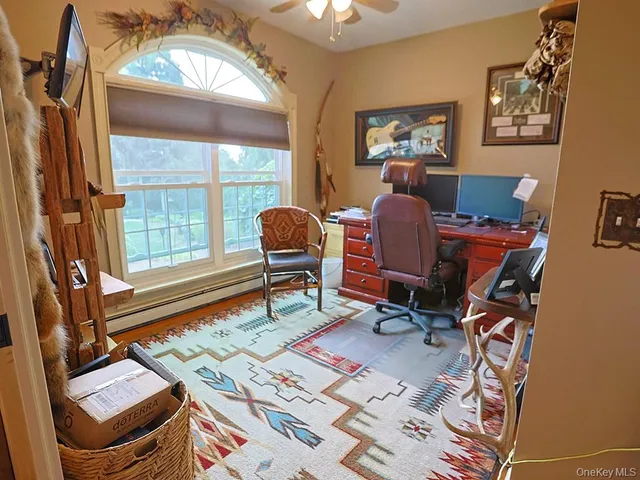 a workspace with furniture and a window