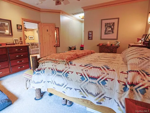 a bathroom with a granite countertop bathtub sink mirror vanity and toilet
