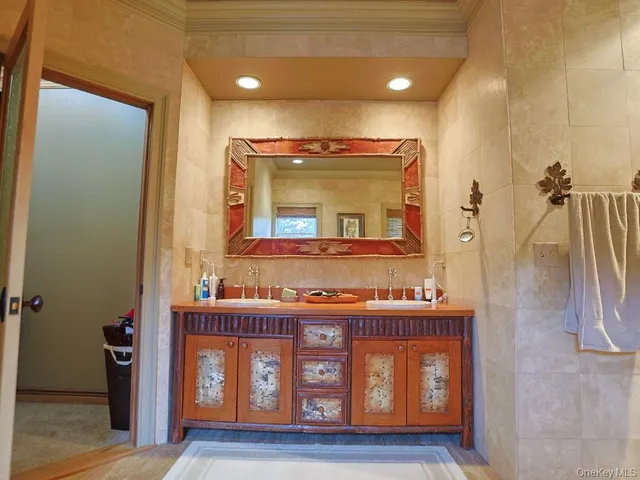 a bathroom with a tub and a sink