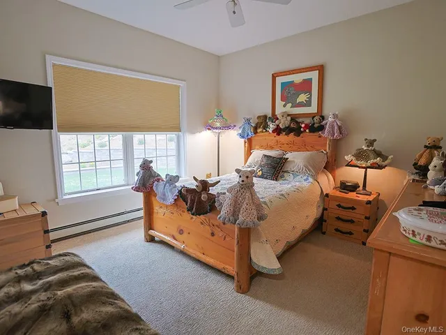 a bathroom with a granite countertop sink toilet and a mirror