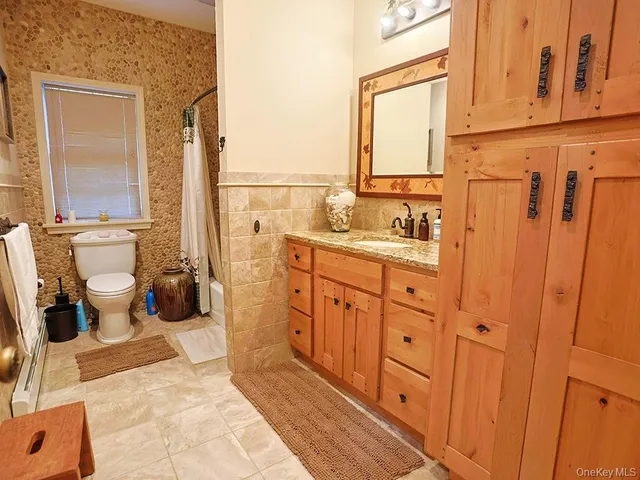 a bathroom with a shower and a shower