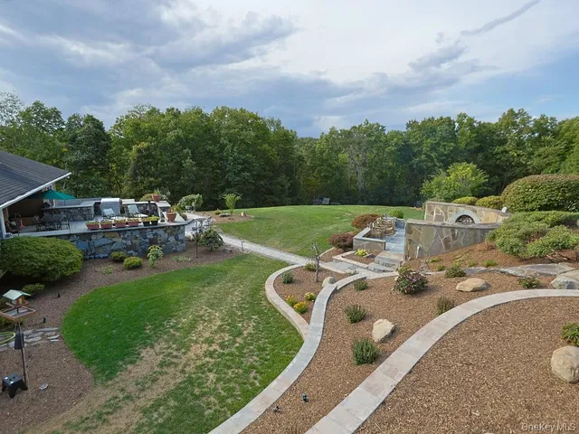 an aerial view of a house with outdoor space
