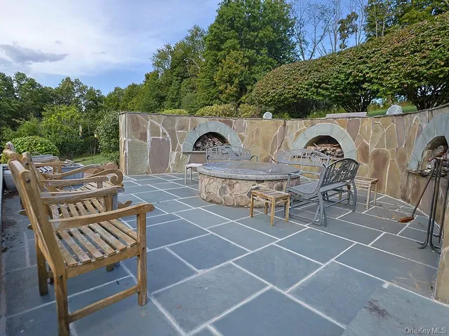 a view of a chairs and table in the patio