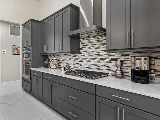 a spacious bedroom with a bed and a large window