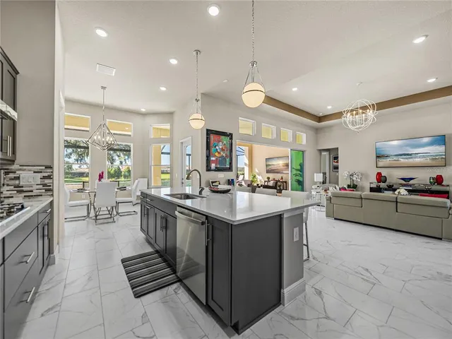 a spacious bathroom with a double vanity sink toilet mirror and shower