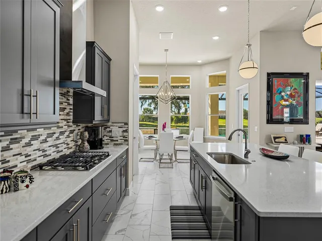 a white bath tub sitting in a bathroom next to a window