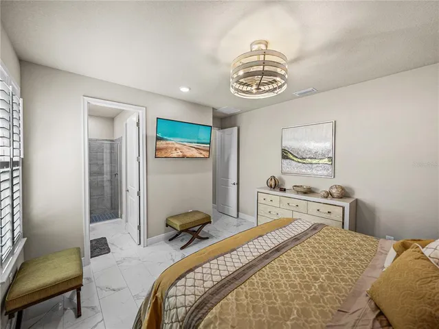 a view of a balcony with chairs and iron fence