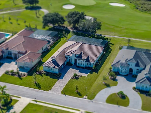 a living room with lots of furniture and kitchen view