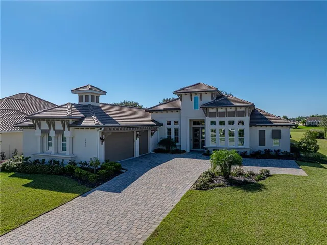 a living room with furniture and chandelier