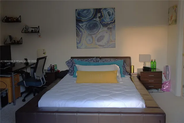 a room with gym equipment and a potted plant