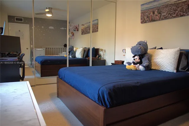 a bedroom with a bed and a couch