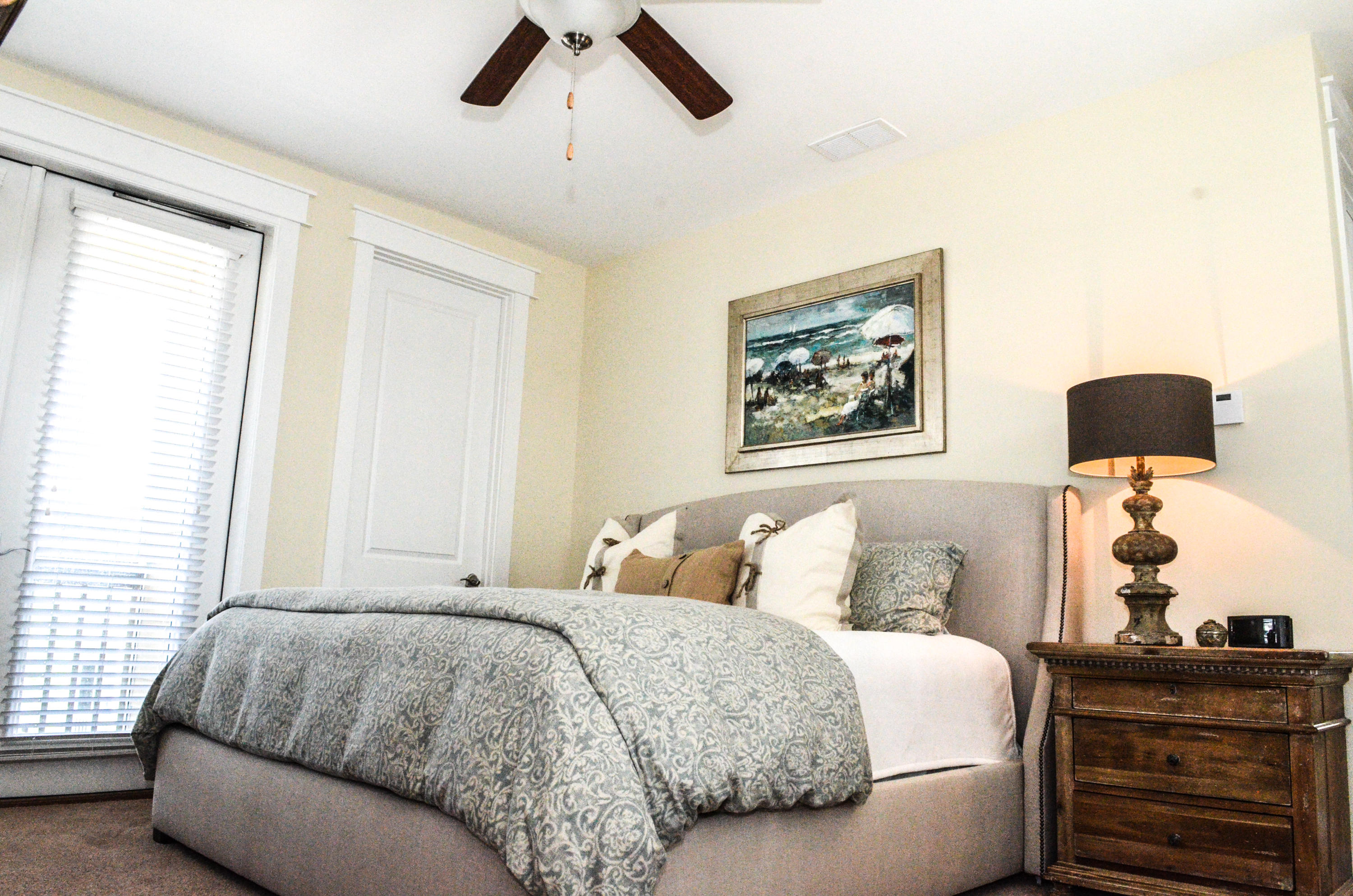 27 Rain Lily Lane Santa Rosa Beach, FL 32459 - Photo 12 of 21 a bedroom with a bed and dresser with mirror