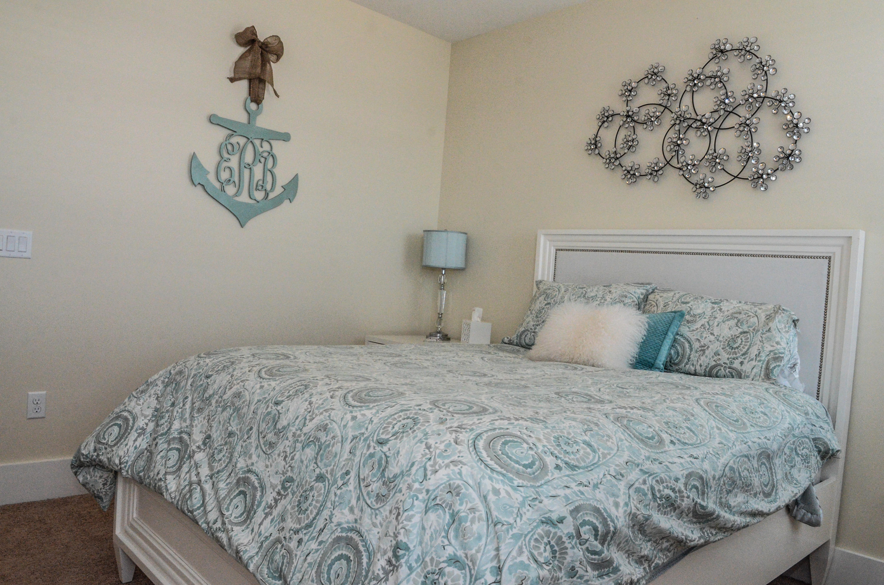 27 Rain Lily Lane Santa Rosa Beach, FL 32459 - Photo 16 of 21 a bedroom with a bed and painting on the wall
