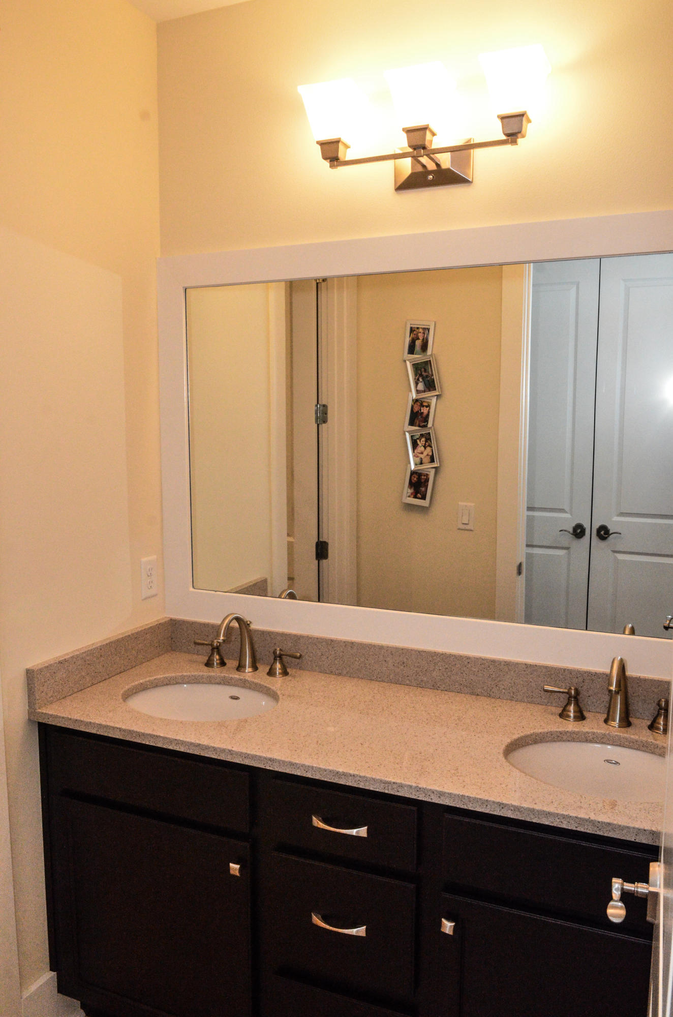27 Rain Lily Lane Santa Rosa Beach, FL 32459 - Photo 17 of 21 a bathroom with a double vanity sink and a mirror