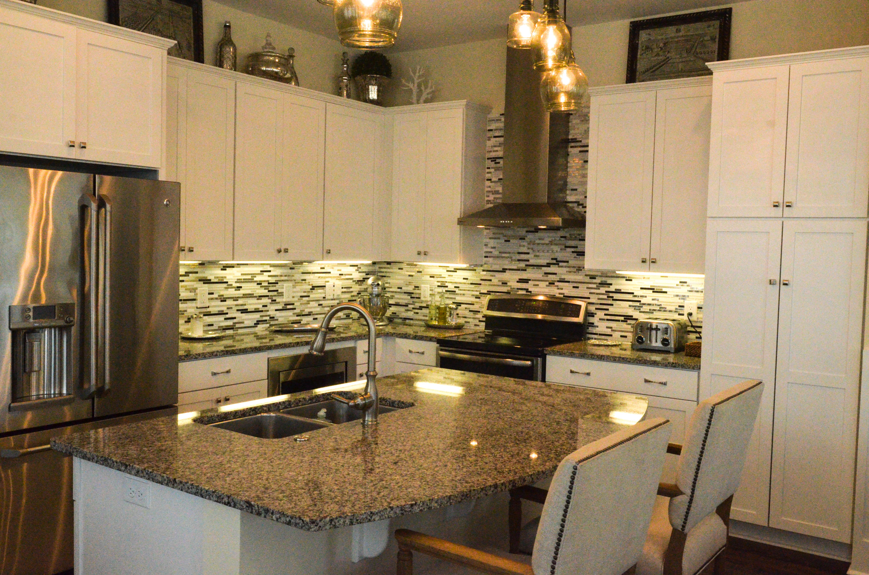 27 Rain Lily Lane Santa Rosa Beach, FL 32459 - Photo 6 of 21 a kitchen with kitchen island granite countertop a sink a stove and refrigerator