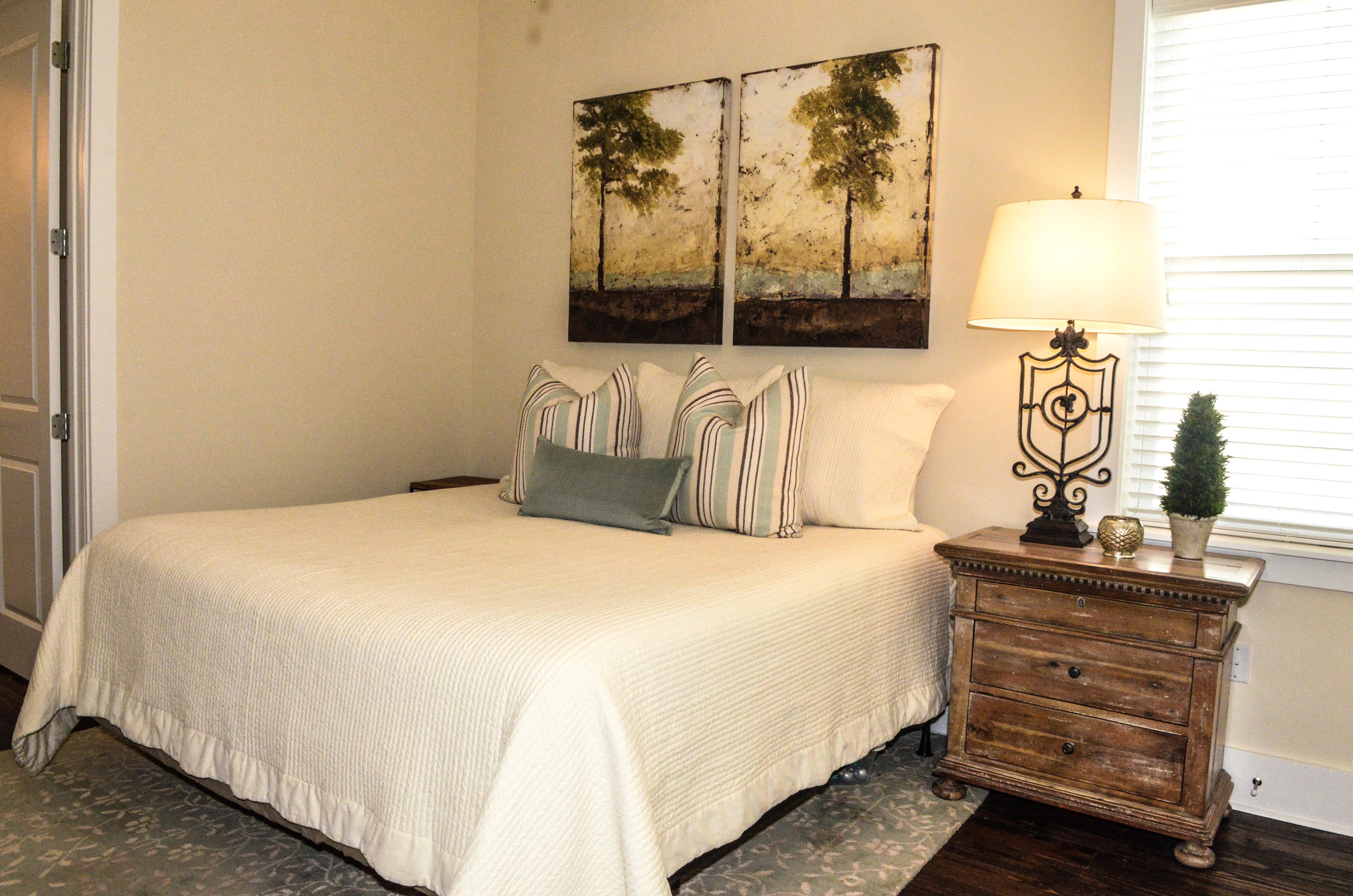 27 Rain Lily Lane Santa Rosa Beach, FL 32459 - Photo 8 of 21 a bedroom with a bed and a painting on the wall