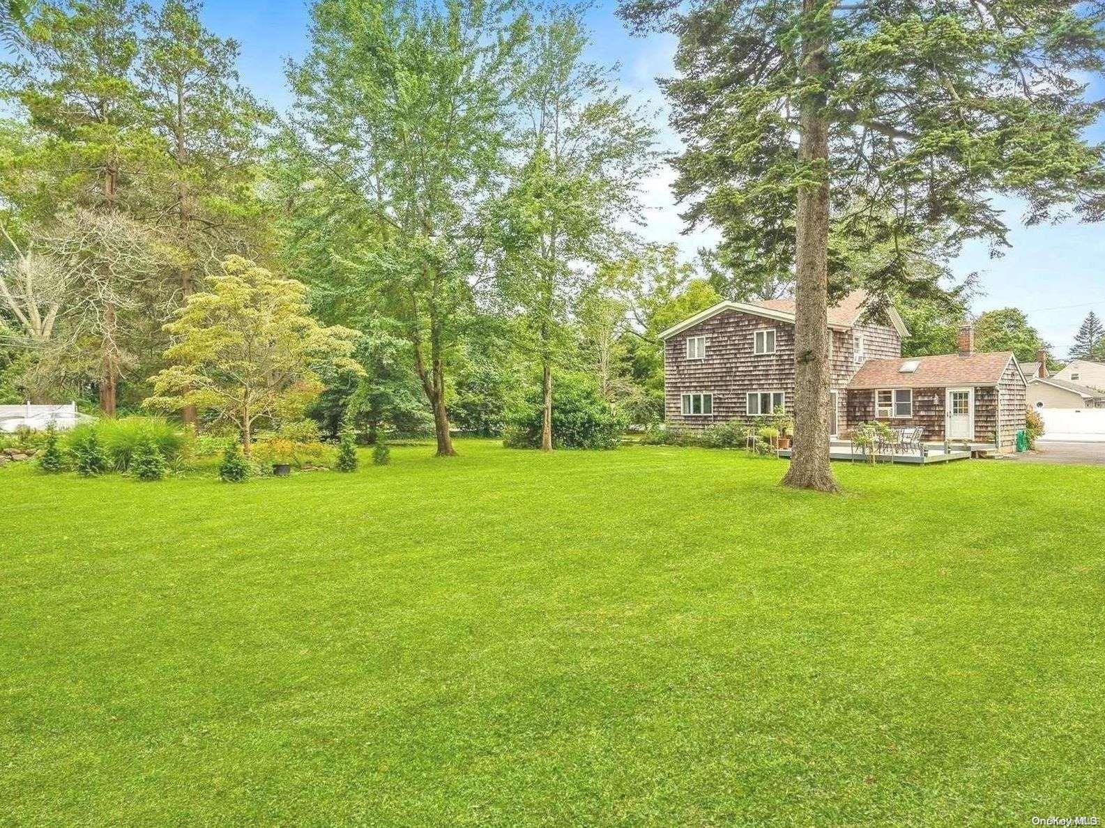 599 South Country Road East Patchogue, NY 11772 - Photo 1 of 1 a view of a house with a big yard