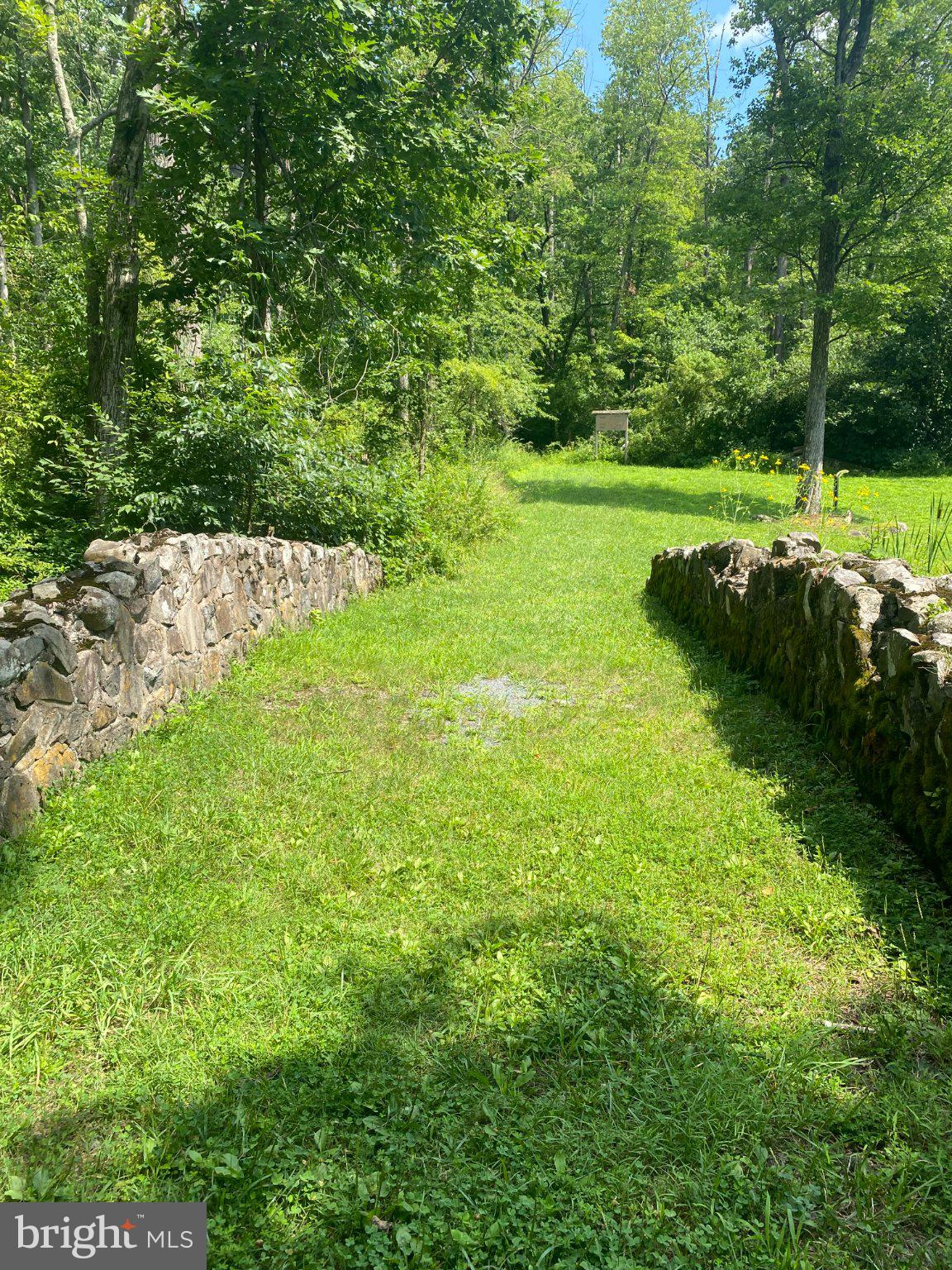 2181 Yerger Road Pottstown, PA 19464 - Photo 20 of 26 Serene path through lush greenery.