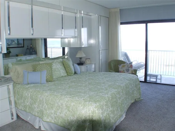 a bedroom with two beds and a window