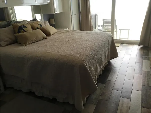 a balcony view with a seating space