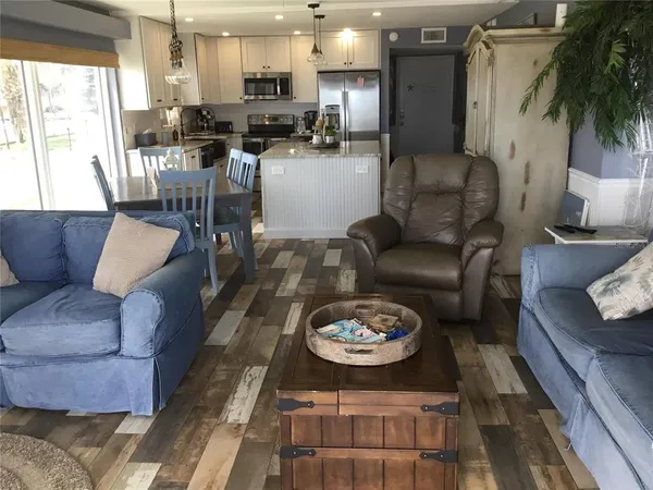 a living room with furniture and a table