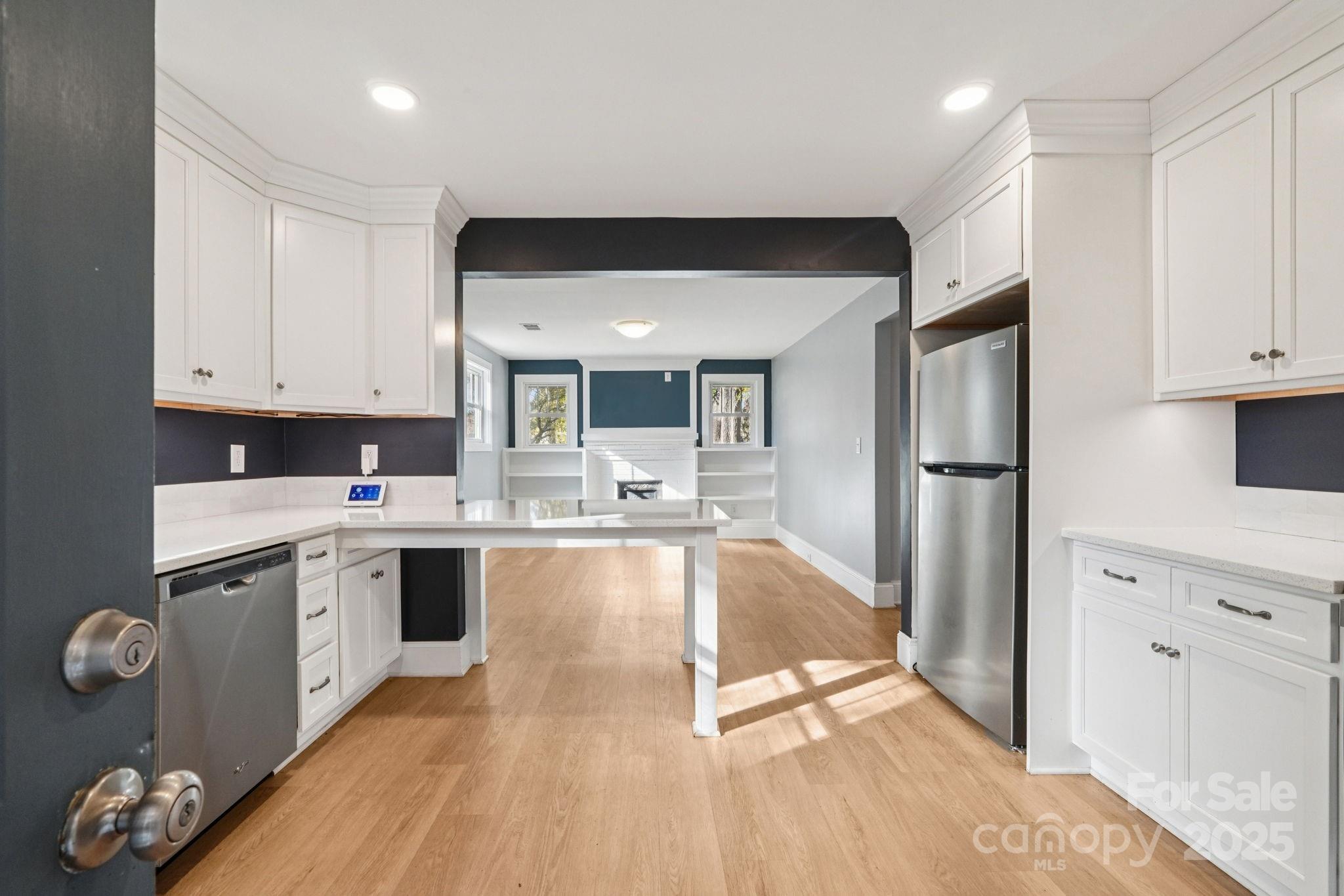 611 Sumner Street Kannapolis, NC 28083 - Photo 11 of 39 a large kitchen with stainless steel appliances granite countertop a refrigerator and a sink