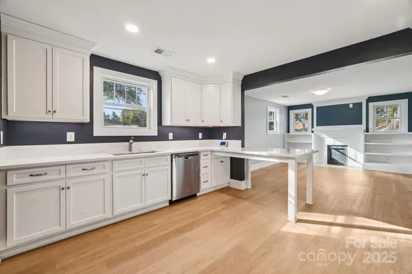 a large kitchen with cabinets