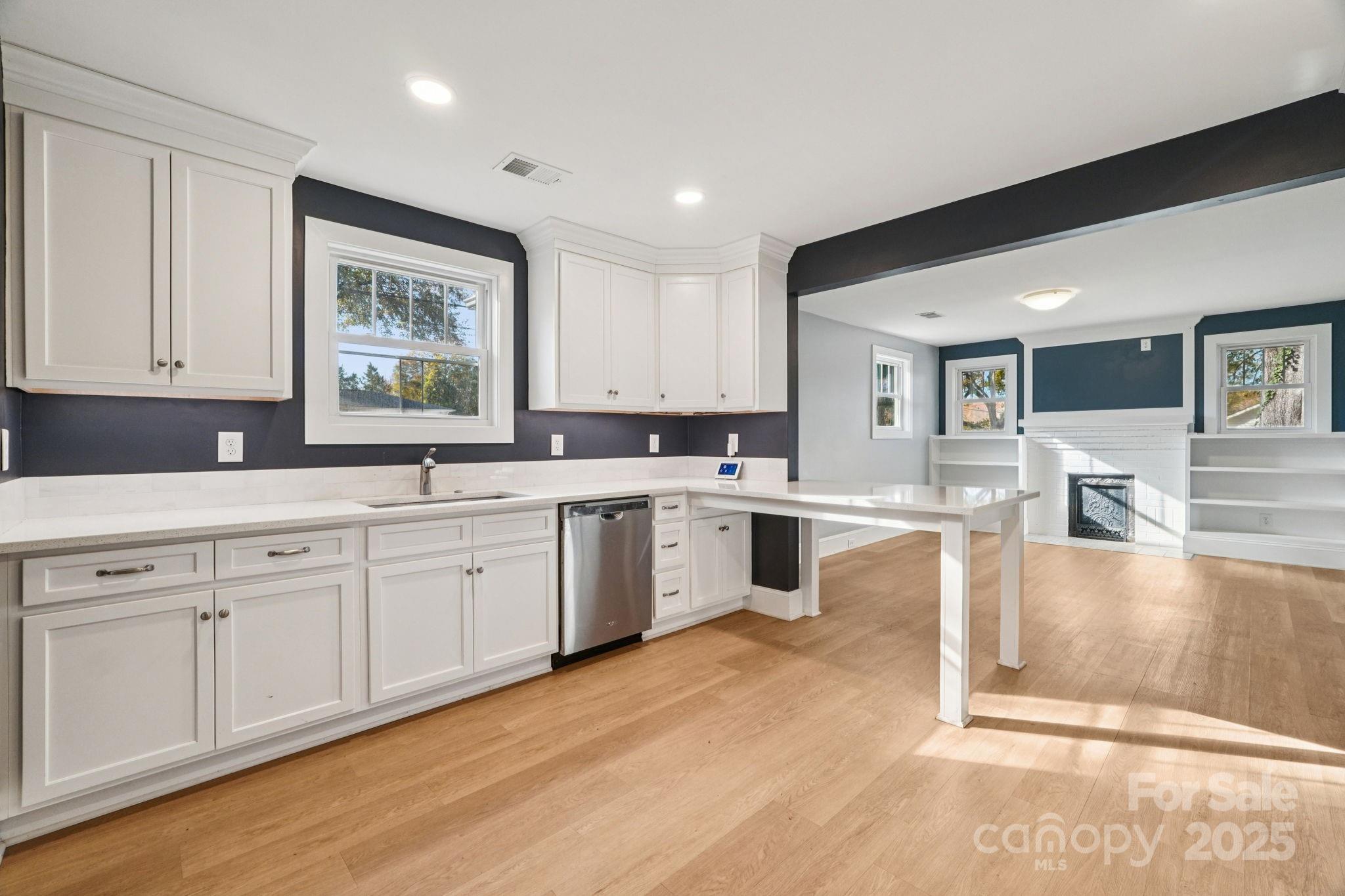 611 Sumner Street Kannapolis, NC 28083 - Photo 12 of 39 a large kitchen with cabinets