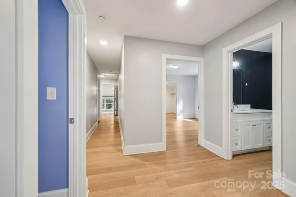 wooden floor with white walls