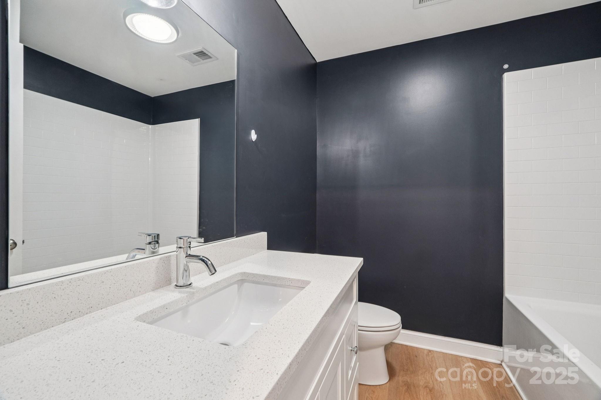 611 Sumner Street Kannapolis, NC 28083 - Photo 19 of 39 a bathroom with a sink and a toilet