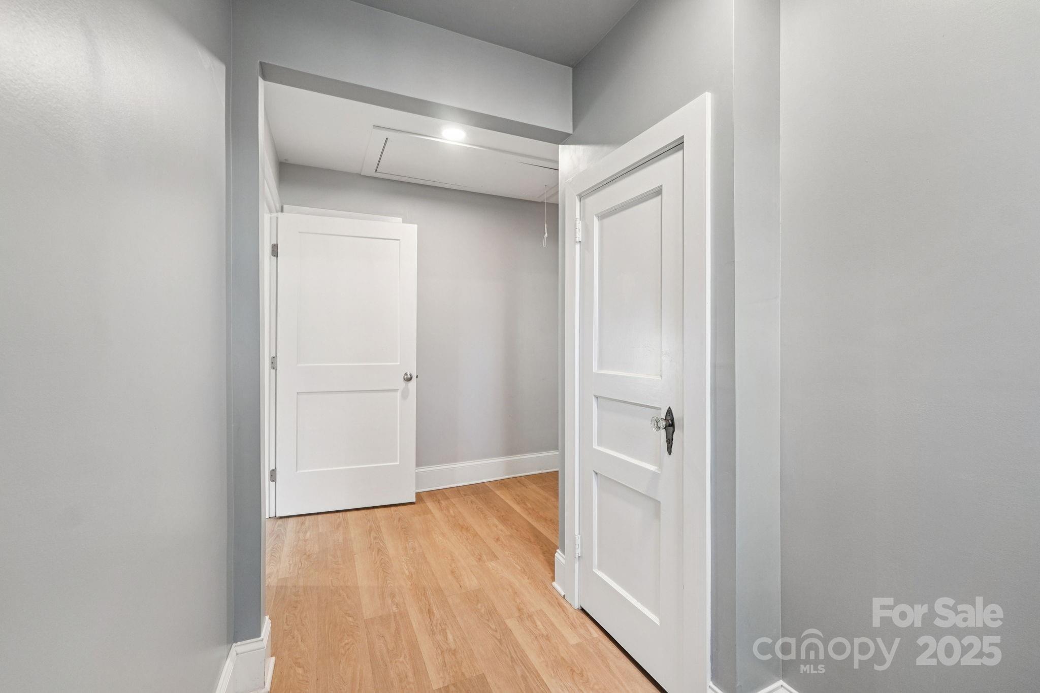 611 Sumner Street Kannapolis, NC 28083 - Photo 25 of 39 a view of an empty walk in closet with wooden floor