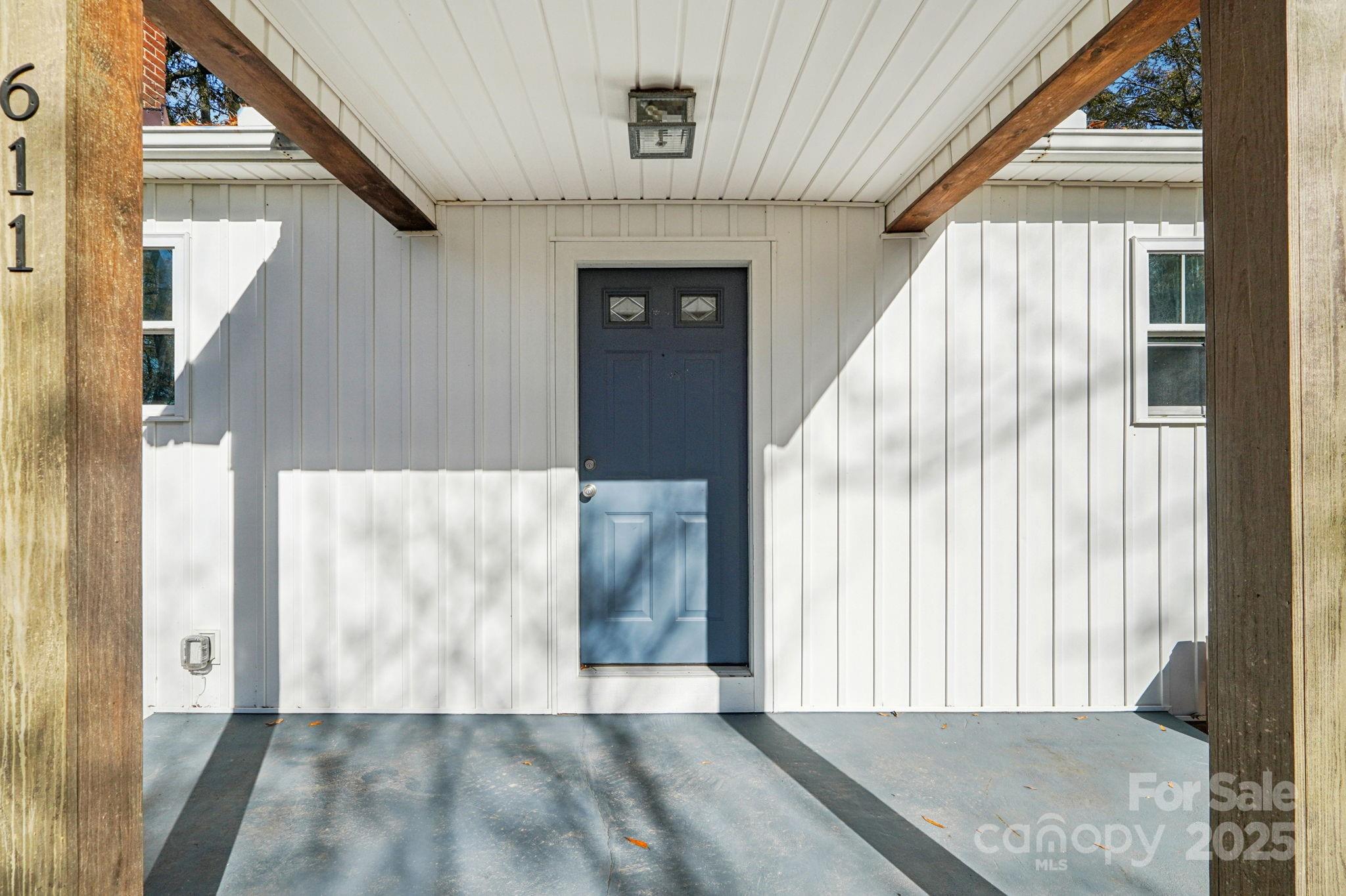 611 Sumner Street Kannapolis, NC 28083 - Photo 3 of 39 a view of entry way with wooden floor and staircase