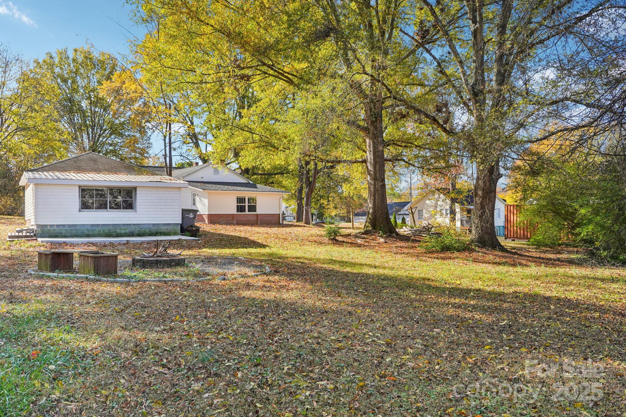 611 Sumner Street Kannapolis, NC 28083 - Photo 33 of 39 a house view with swimming pool in front of it