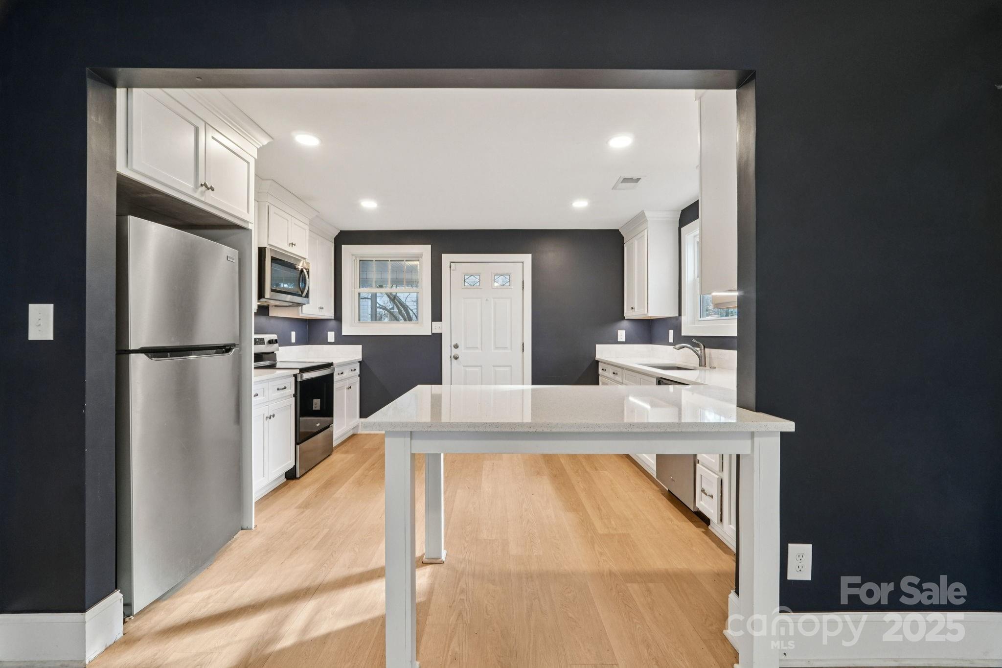 611 Sumner Street Kannapolis, NC 28083 - Photo 8 of 39 a kitchen with stainless steel appliances granite countertop a refrigerator a stove and a sink