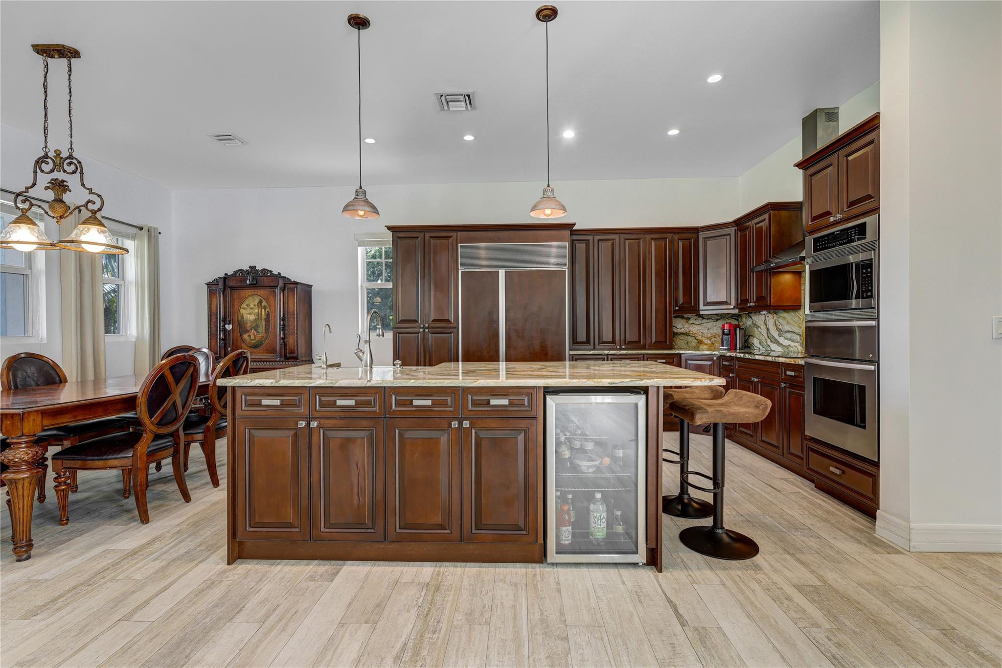 6601 Appaloosa Trail Southwest Ranches, FL 33330 - Photo 14 of 49 a kitchen with granite countertop a sink cabinets and wooden floor