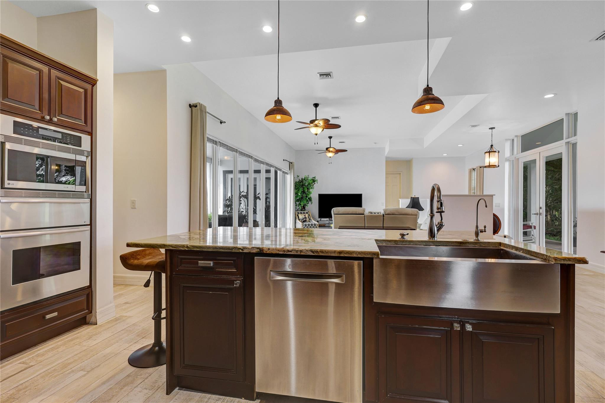6601 Appaloosa Trail Southwest Ranches, FL 33330 - Photo 22 of 49 a kitchen with a sink stainless steel appliances and cabinets