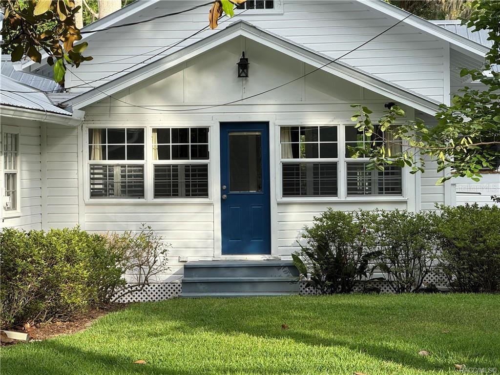 5217 Riverside Drive Yankeetown, FL 34498 - Photo 18 of 54 a front view of a house with a yard