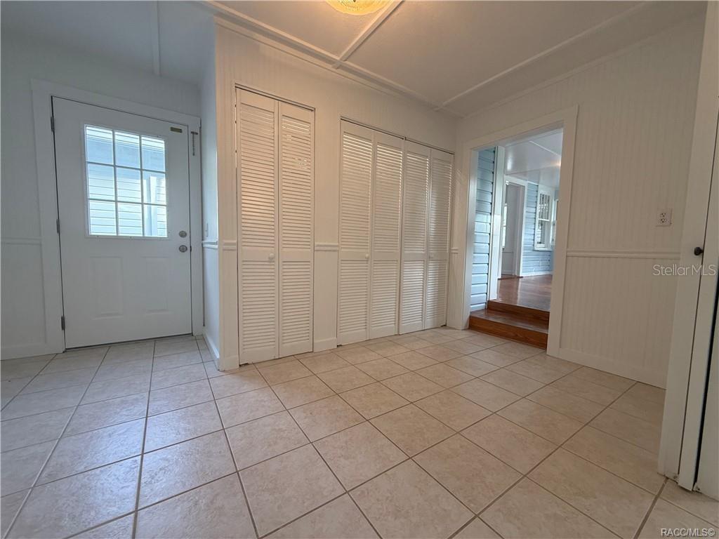 5217 Riverside Drive Yankeetown, FL 34498 - Photo 28 of 54 an empty room with windows