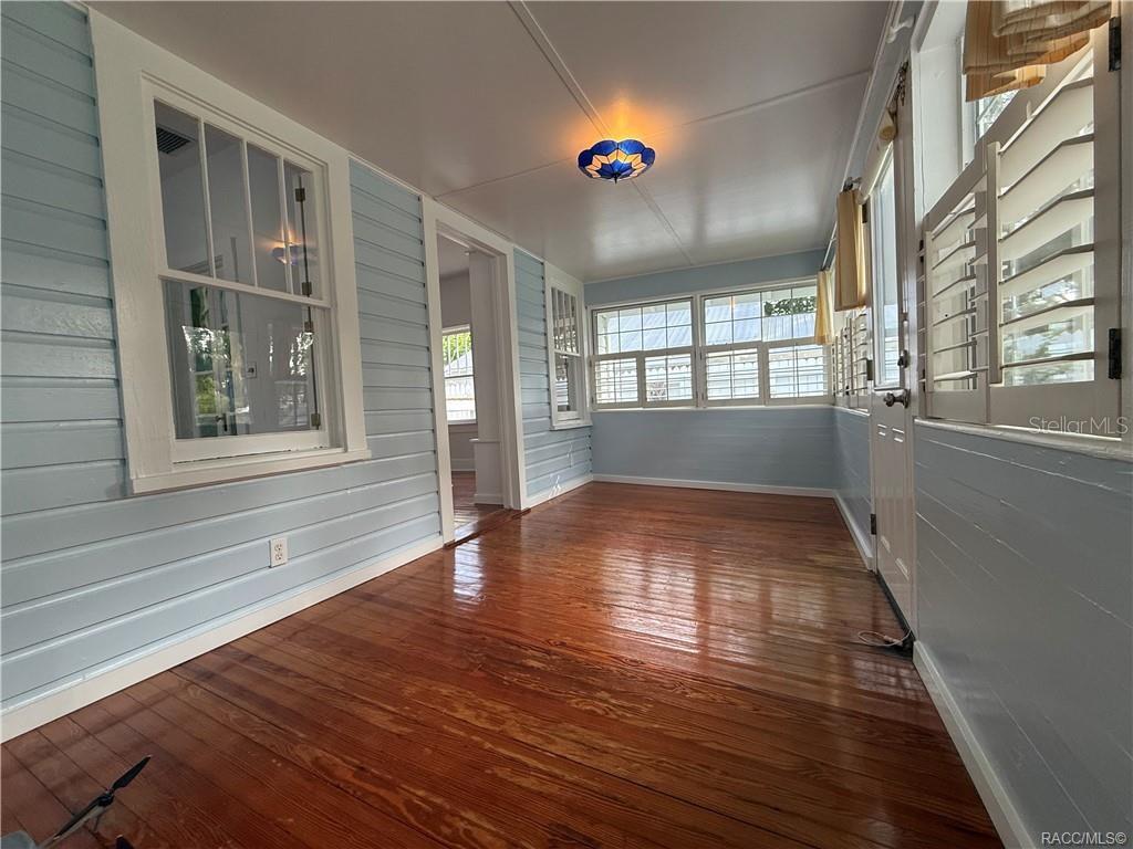 5217 Riverside Drive Yankeetown, FL 34498 - Photo 30 of 54 a view of empty room with wooden floor and fan